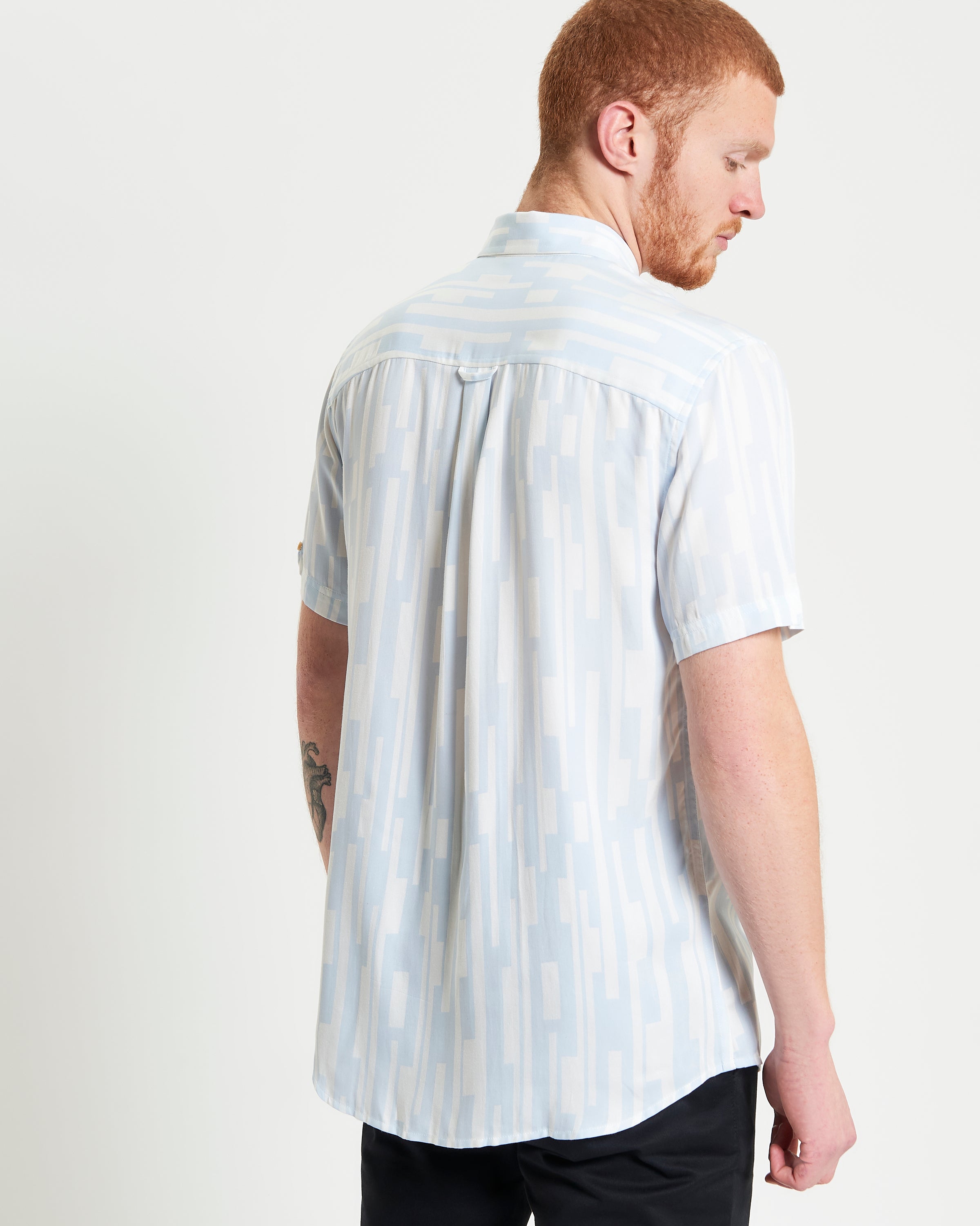 Jazz Lines Print – Back view of a stylish short-sleeve shirt featuring a contemporary abstract pattern.