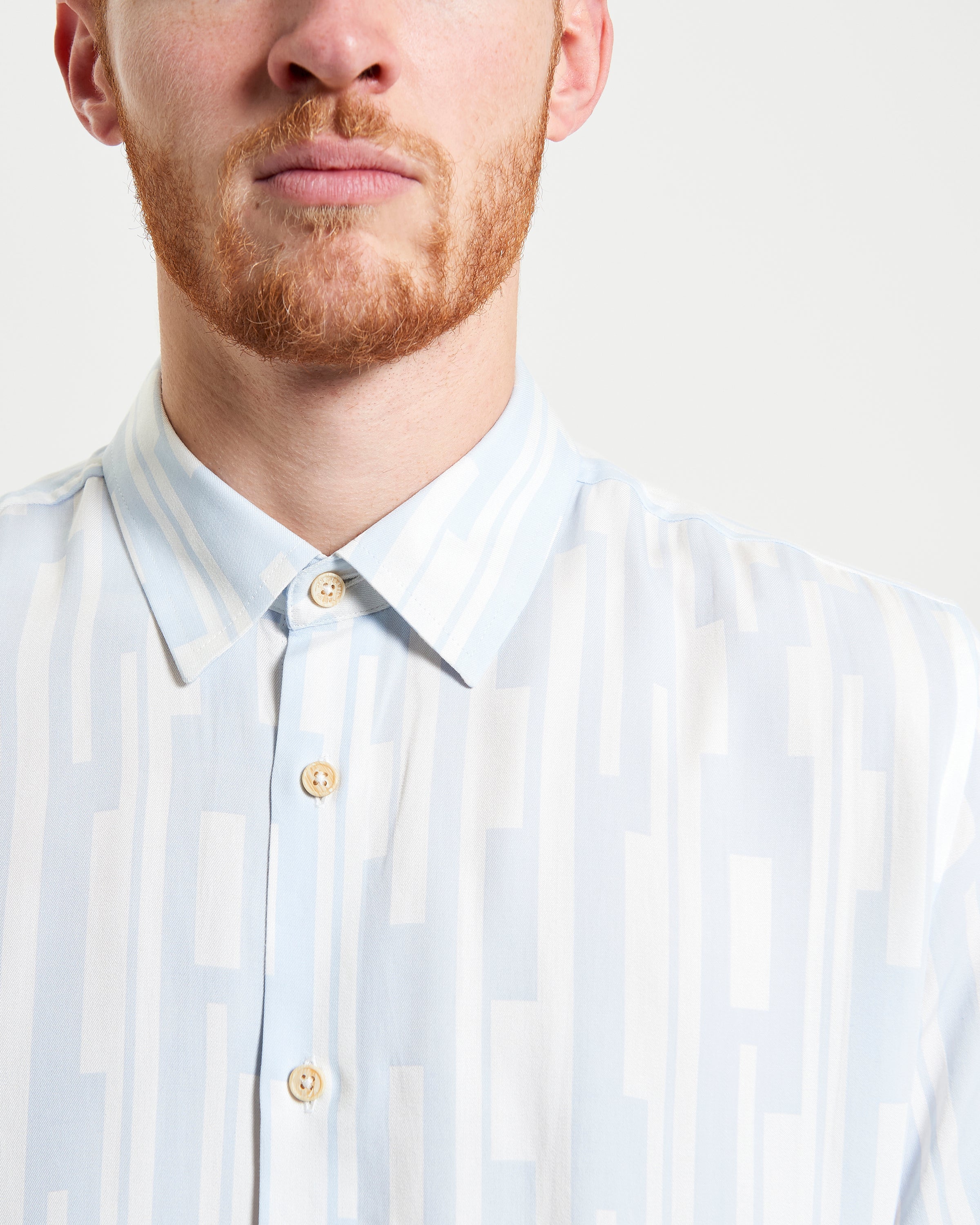 Jazz Lines Print shirt featuring bold graphics and a button-down collar for a stylish smart-casual look.