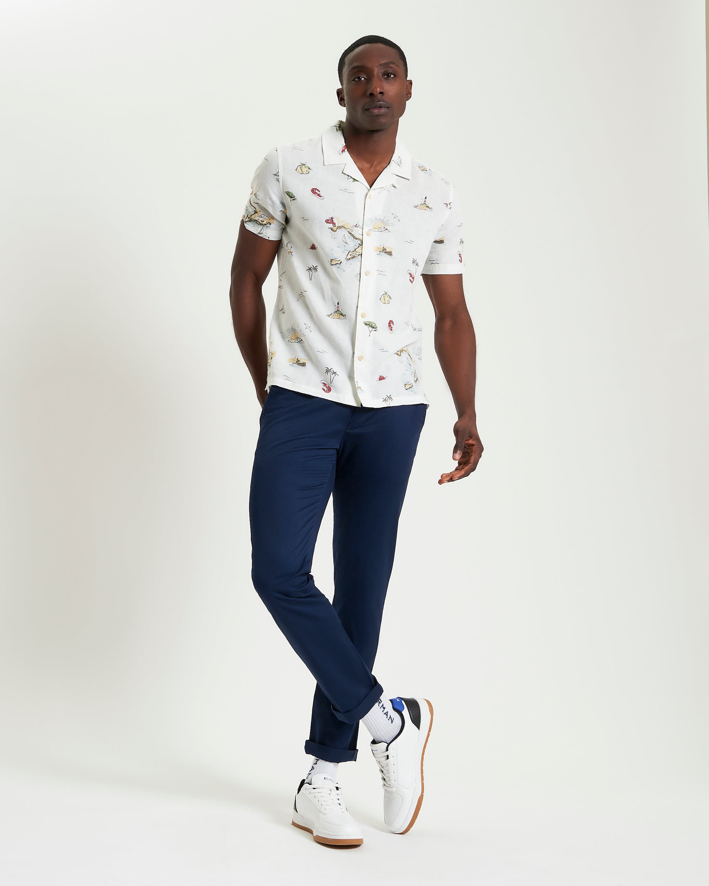 Brighton To Amalfi Print short-sleeve shirt worn by a man, featuring a coastal design and relaxed fit.