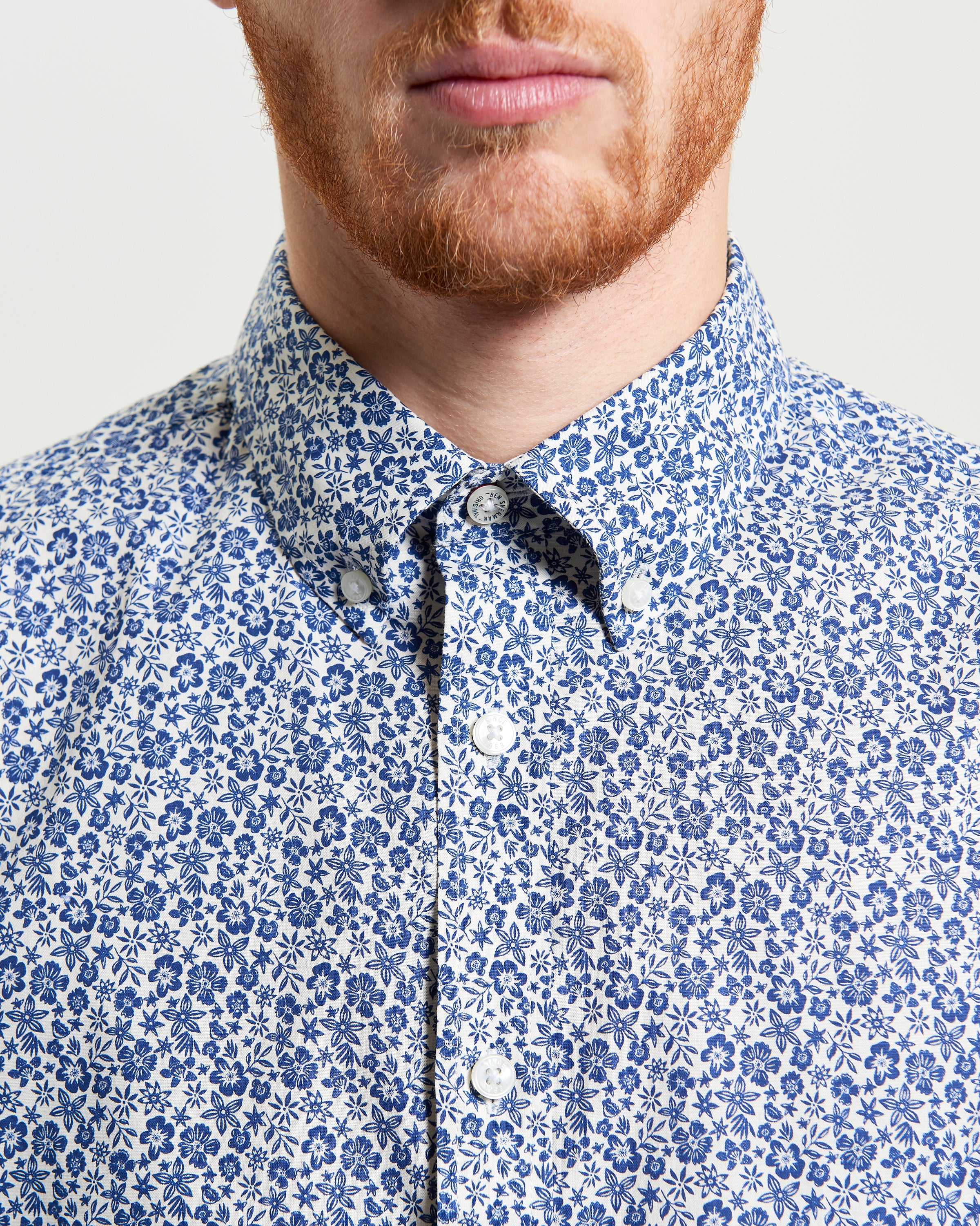 Mono Floral Print shirt featuring a tone-on-tone floral motif and two-finger button-down collar.