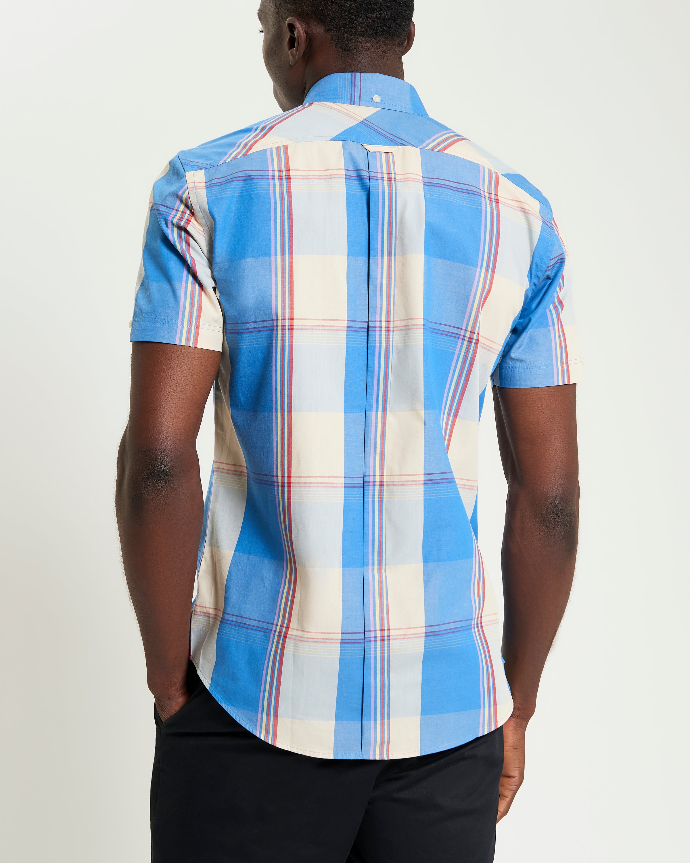 Multicolour Overcheck – Back view of short-sleeve shirt featuring blue and plaid pattern.