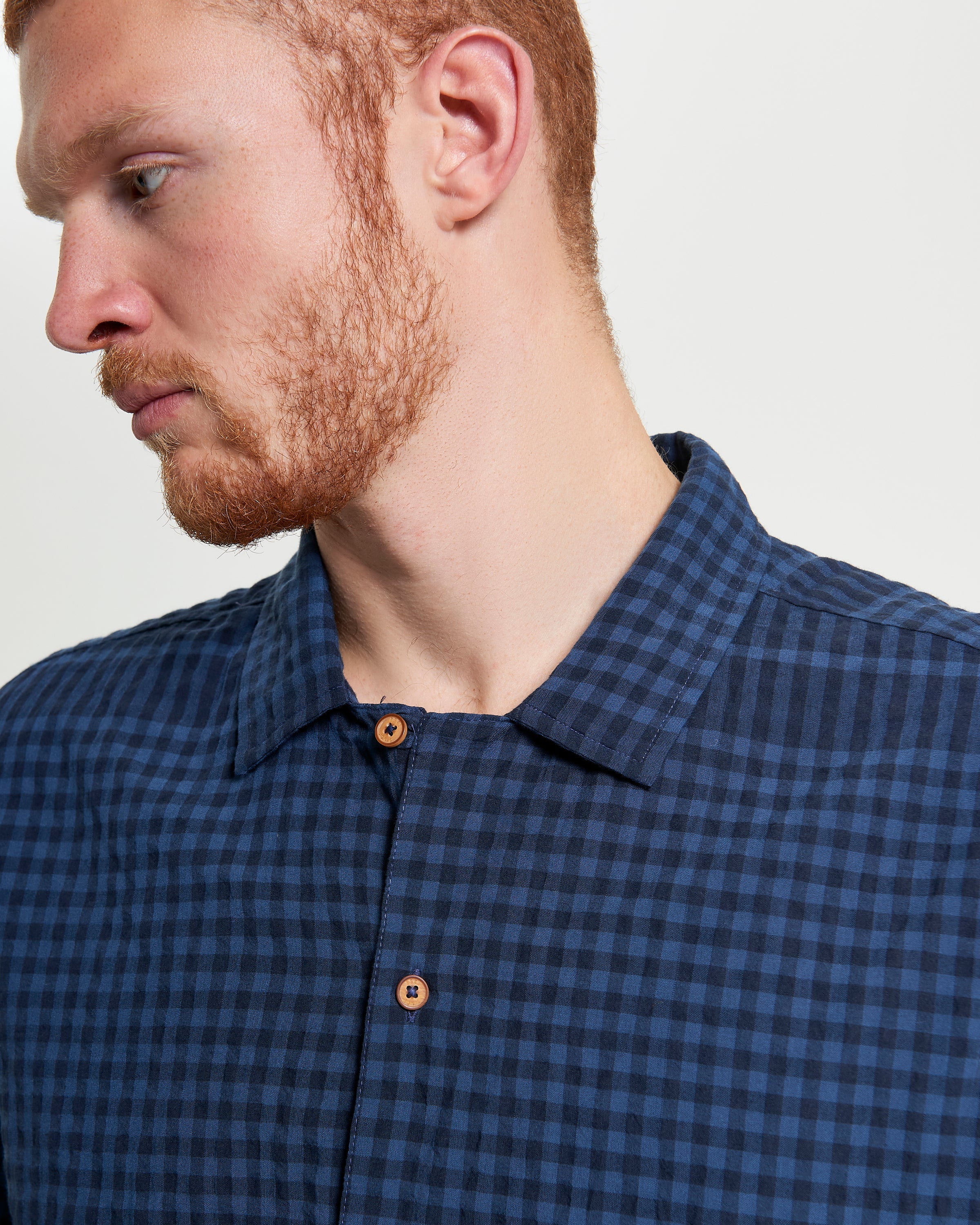 Seersucker Gingham short sleeve shirt featuring a relaxed fit and revere collar, perfect for warm days.