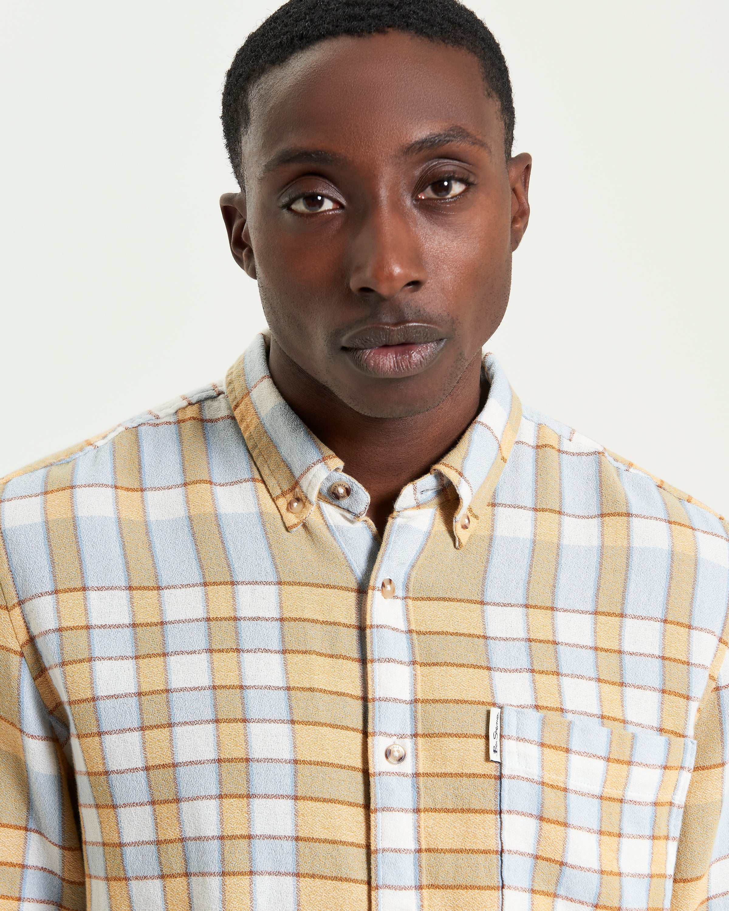 Crepe Check Shirt – Casual and textured cotton shirt with long sleeves and button-down collar.