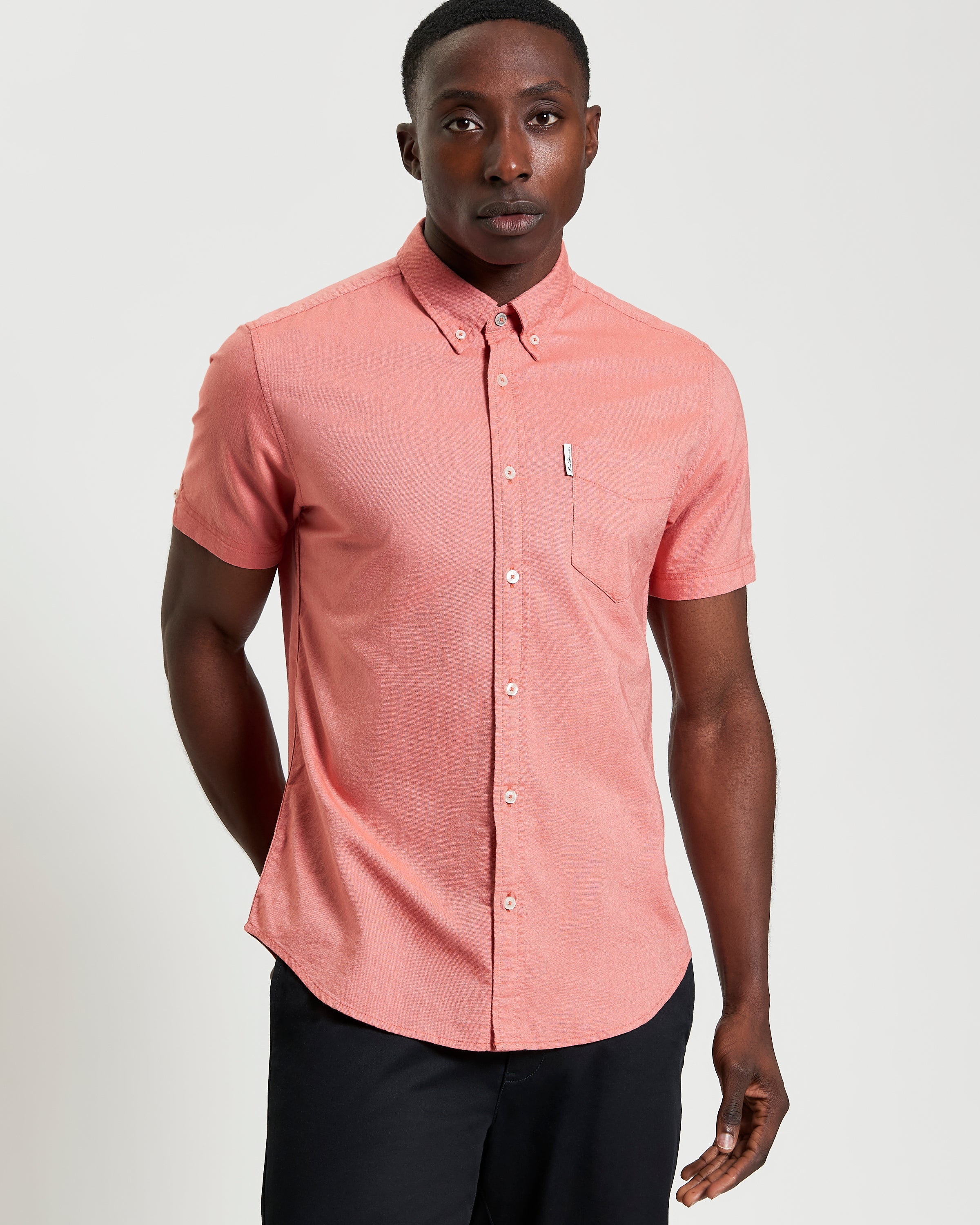 Signature Oxford Short Sleeve Shirt – coral with button-down collar and chest pocket.