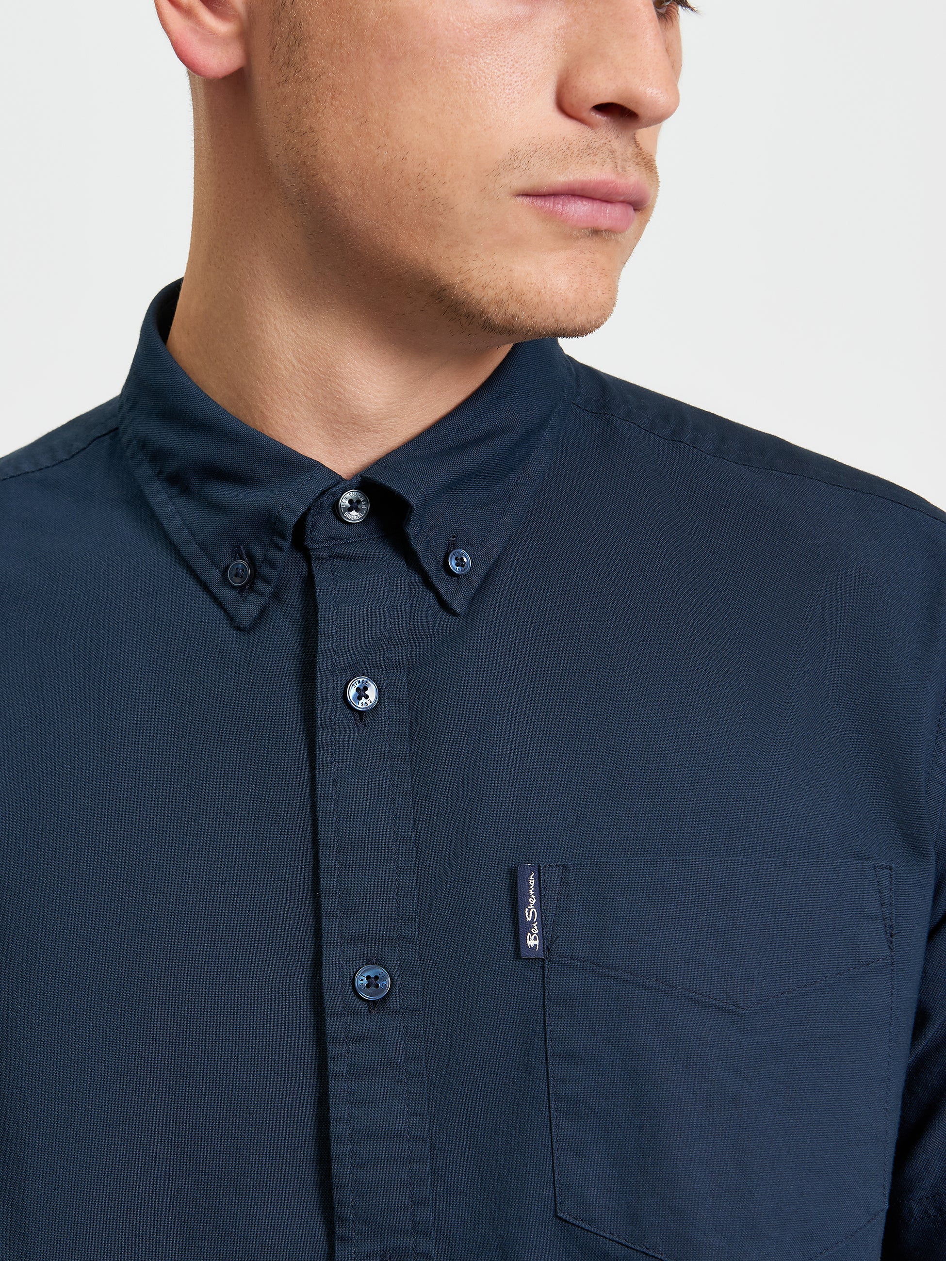 Signature Oxford Short Sleeve Shirt – Navy – featuring a button-down collar and chest pocket with woven label.