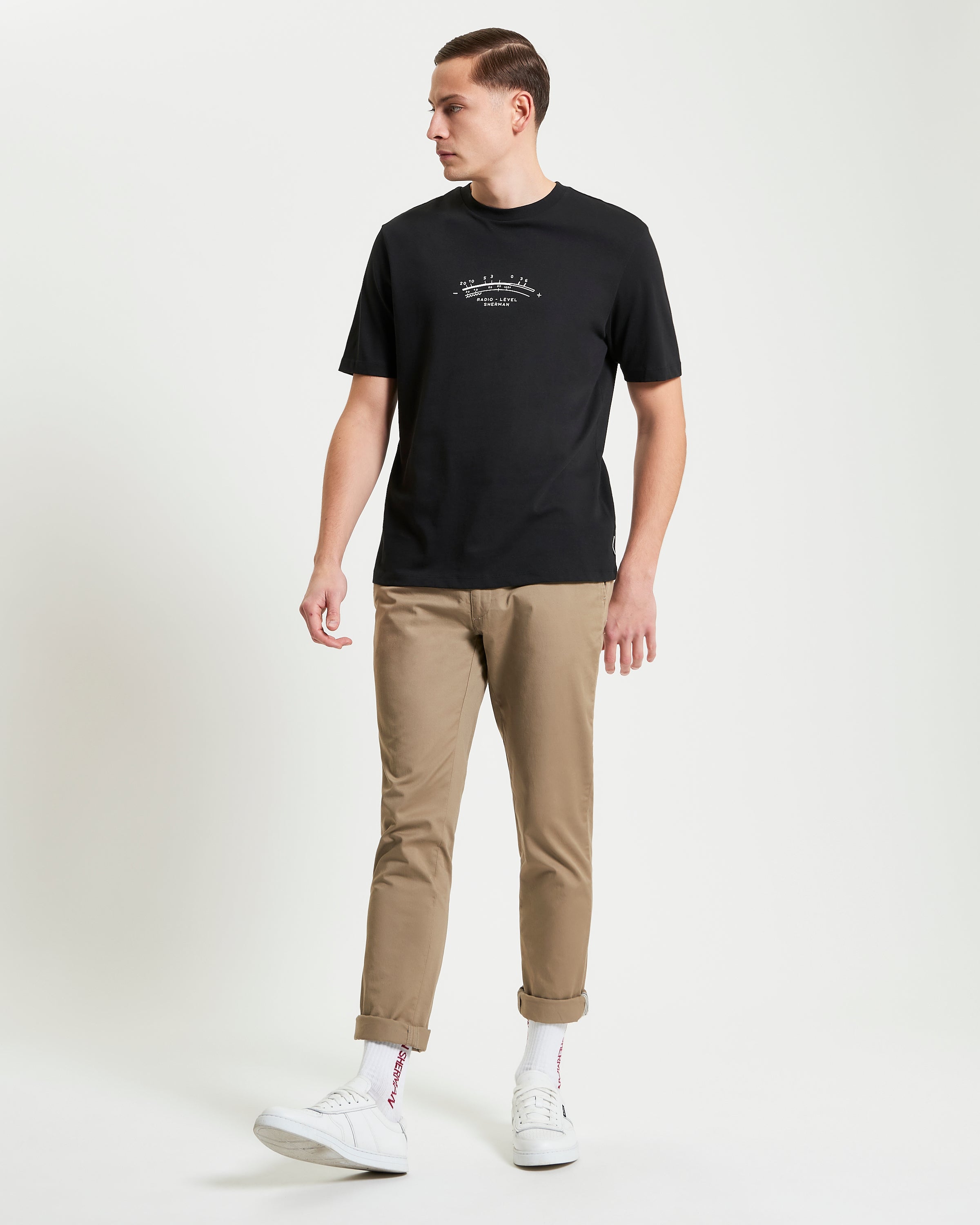 Radio Vibe – Black organic cotton t-shirt featuring pigment chest print and back graphic, relaxed fit.