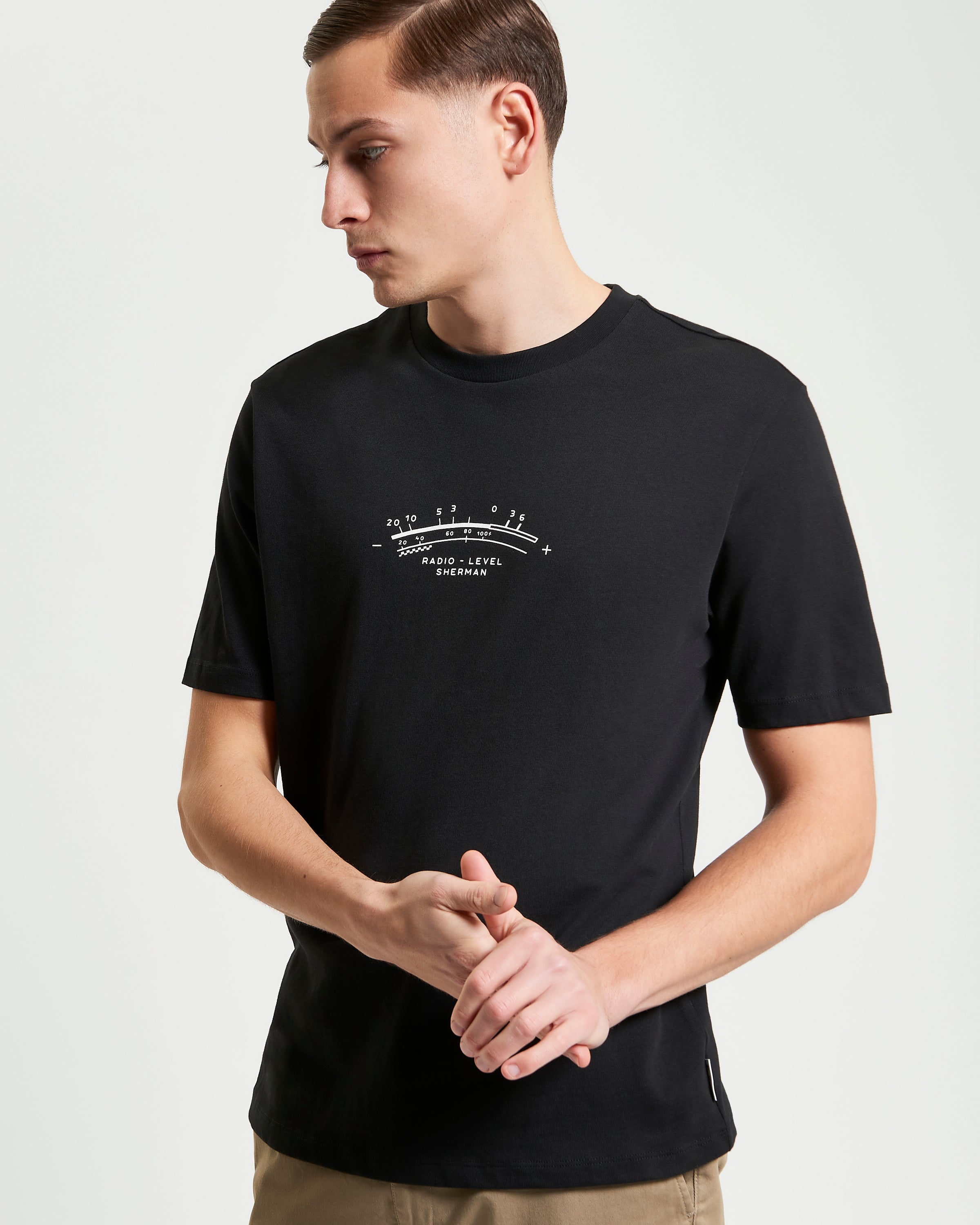 Radio Vibe – black organic cotton t-shirt featuring pigment chest print and relaxed fit.