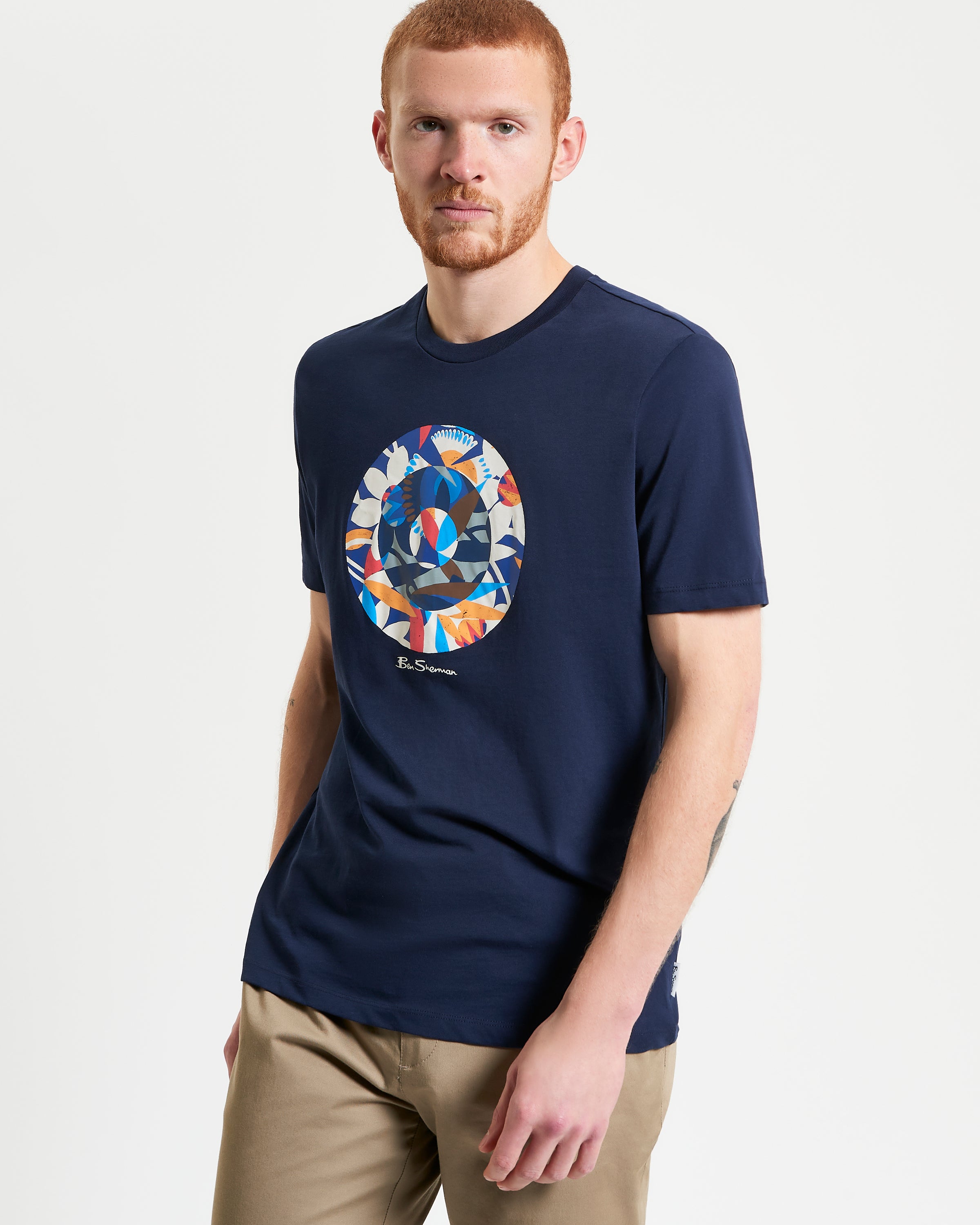 Tropical Target – abstract tropical target pigment print on a navy tee made of organic cotton.