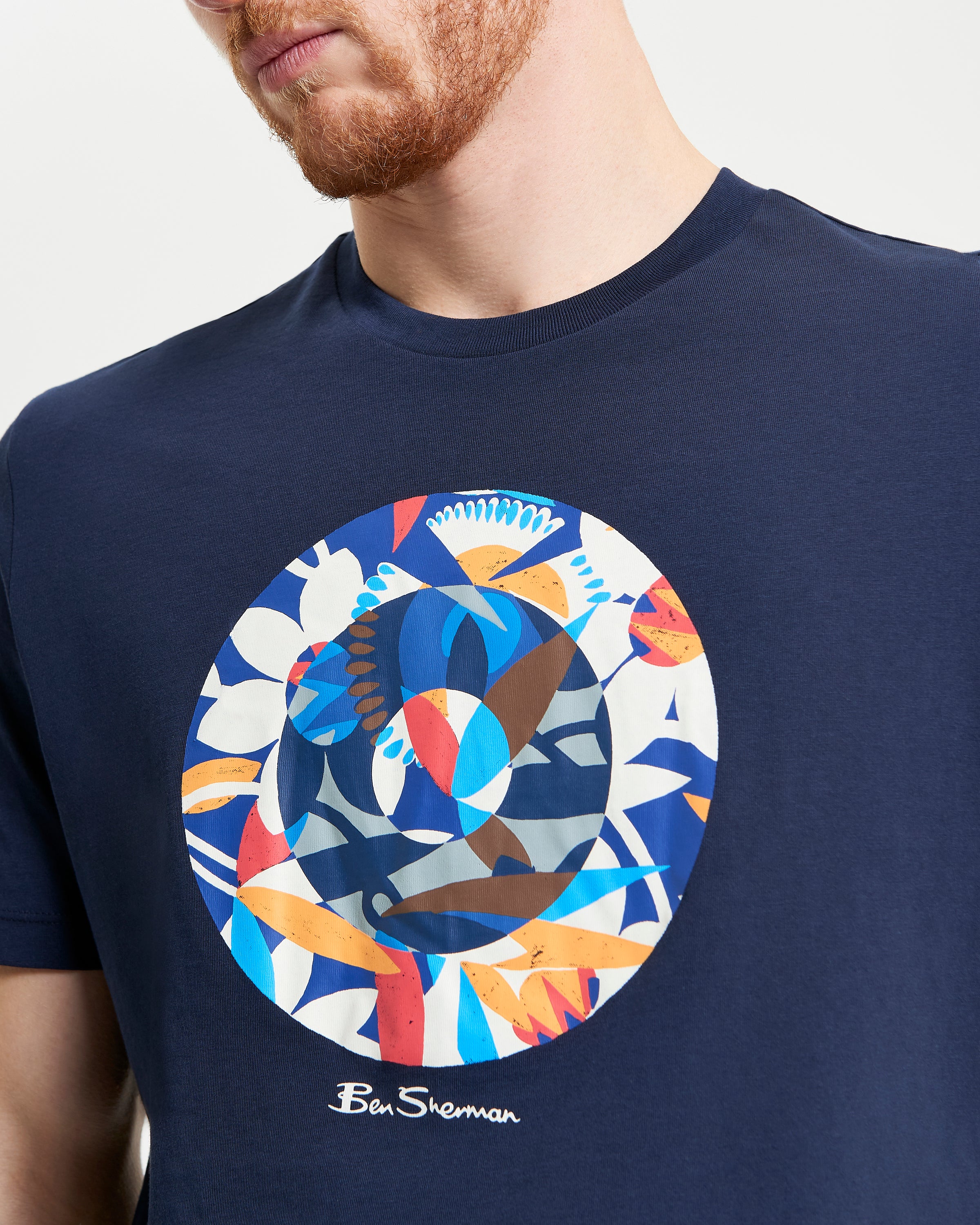 Tropical Target – Navy T-shirt featuring bold abstract tropical target pigment print.