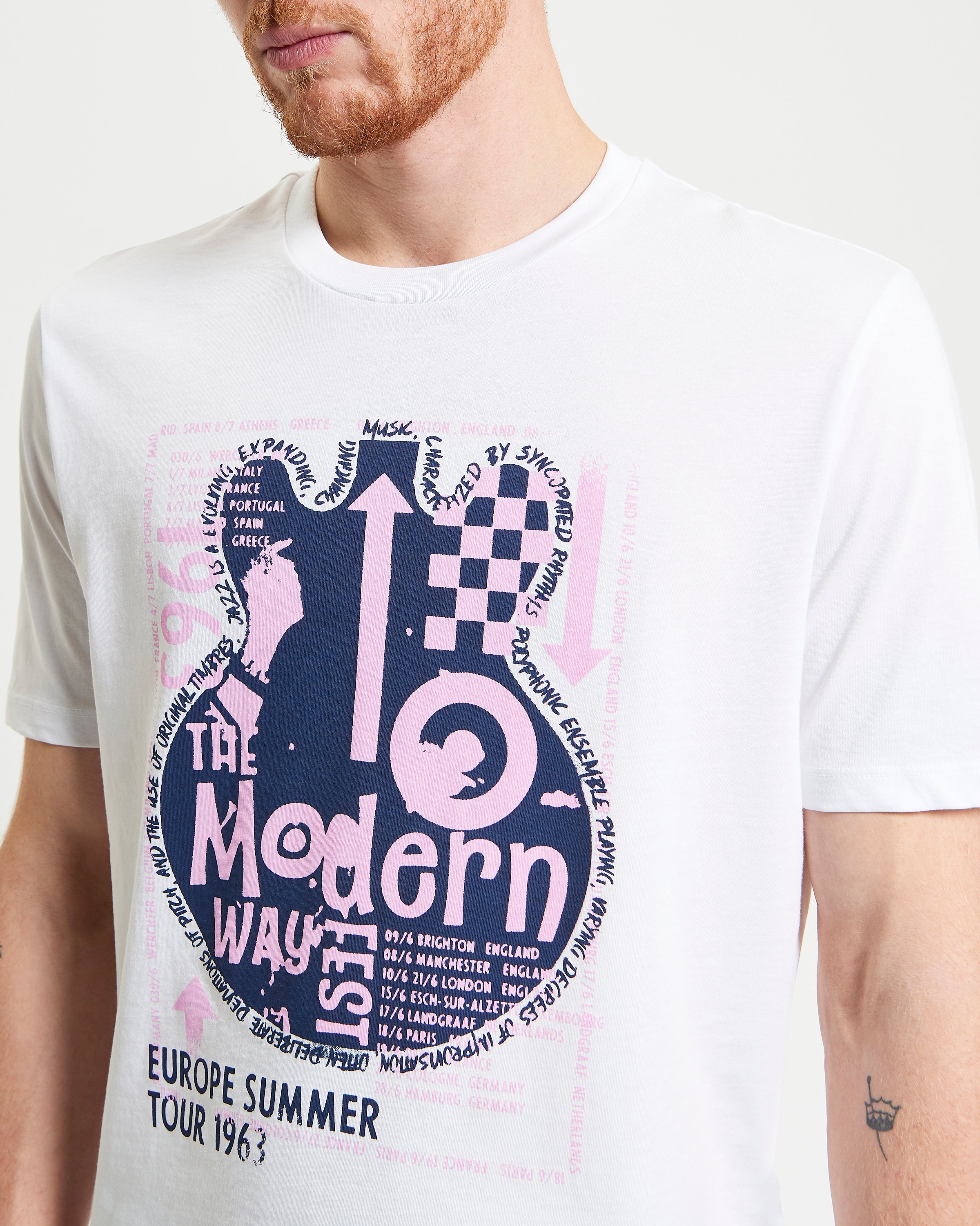 Guitar Poster Tee featuring a bold abstract guitar design and music tour elements, perfect for casual wear.