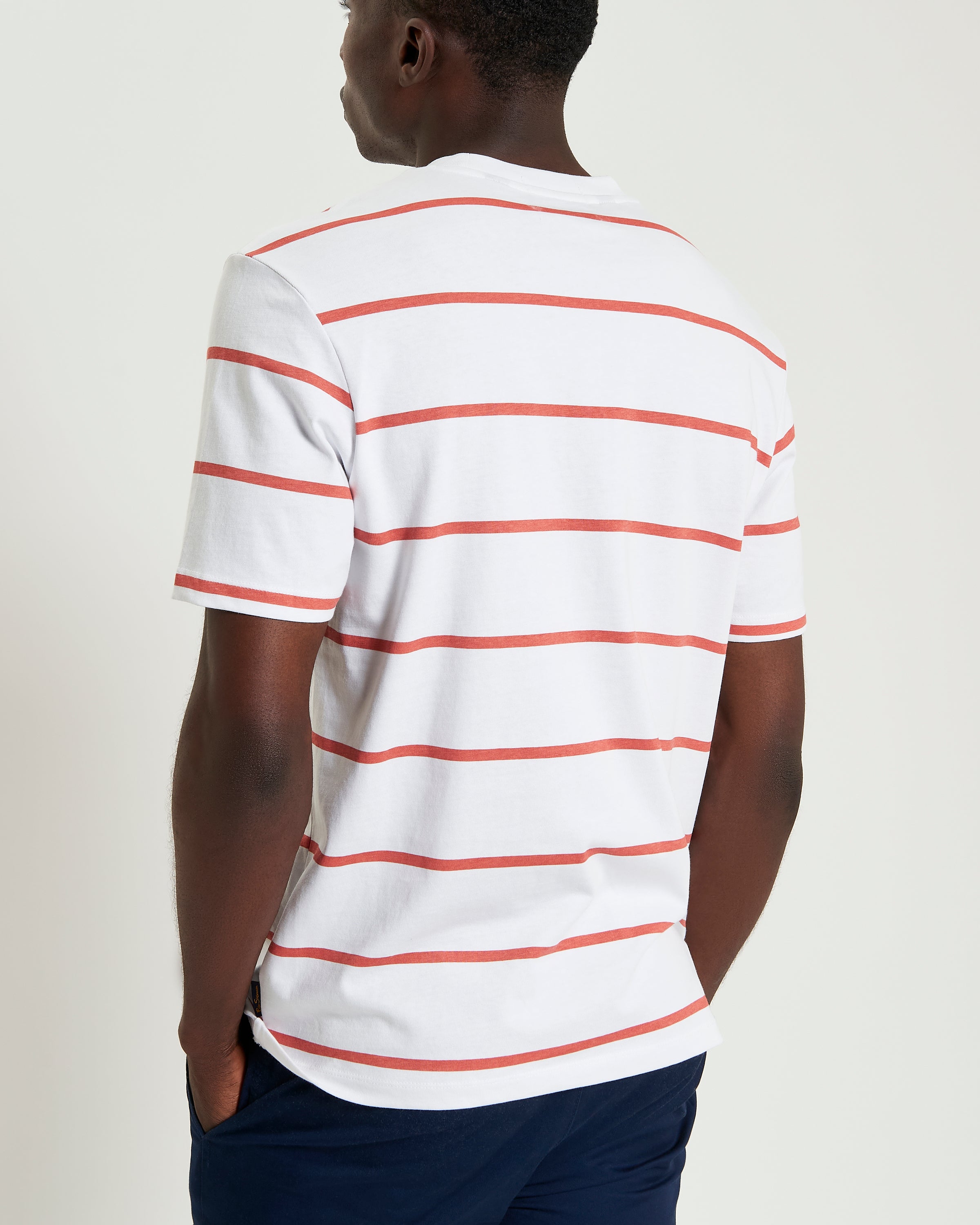 Stripe Script shirt featuring dynamic stripes and subtle script accents, showcased from the back.