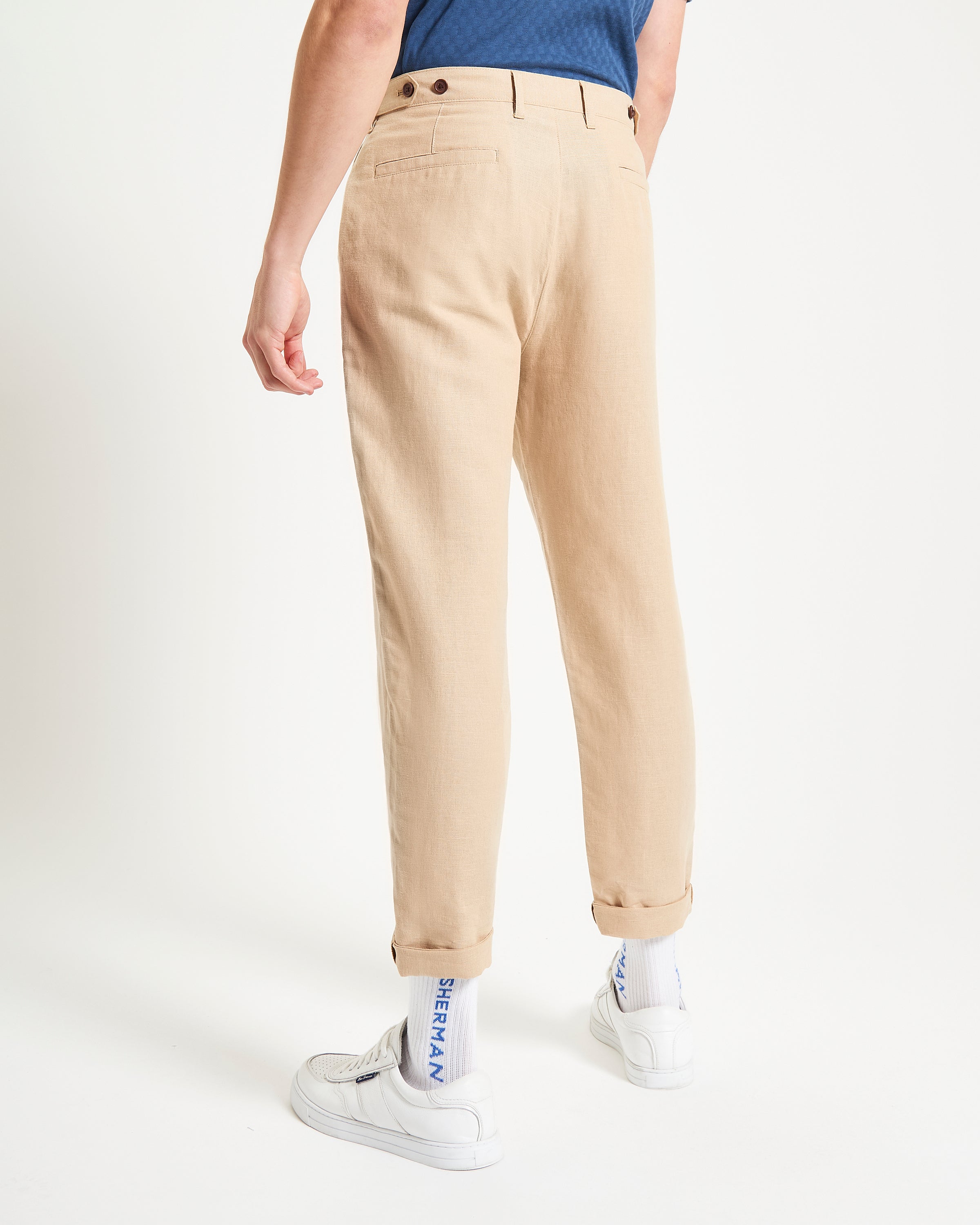 Linen Cotton Trouser – Beige, featuring a slim fit with side adjusters and rolled cuffs for a relaxed style.