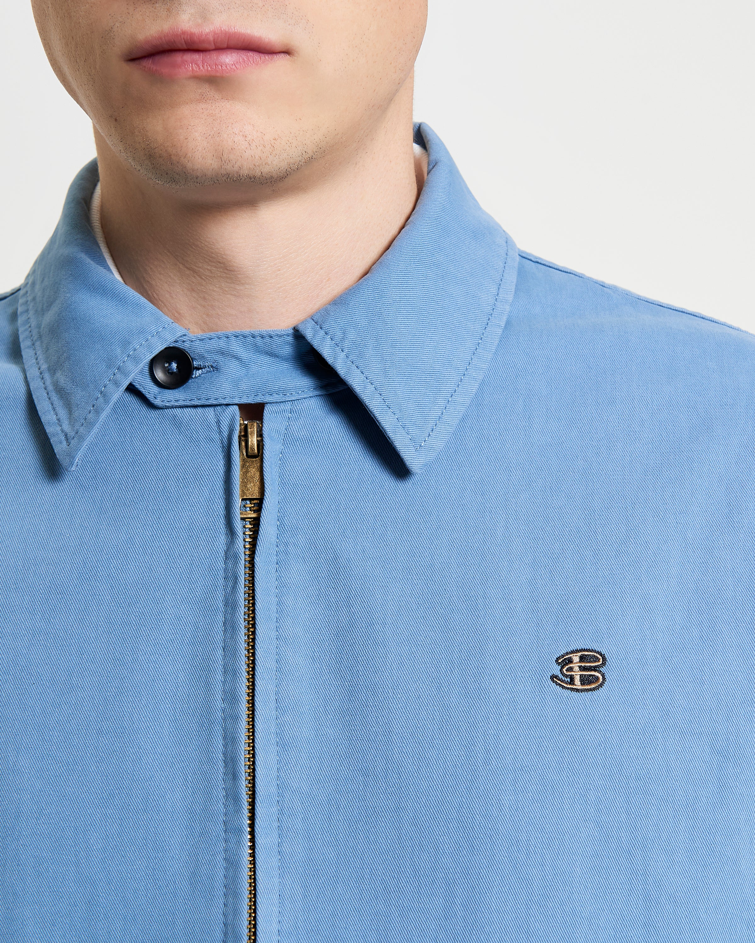 Sports Blouson – blue jacket with full zip and embroidered 'B' logo on the chest
