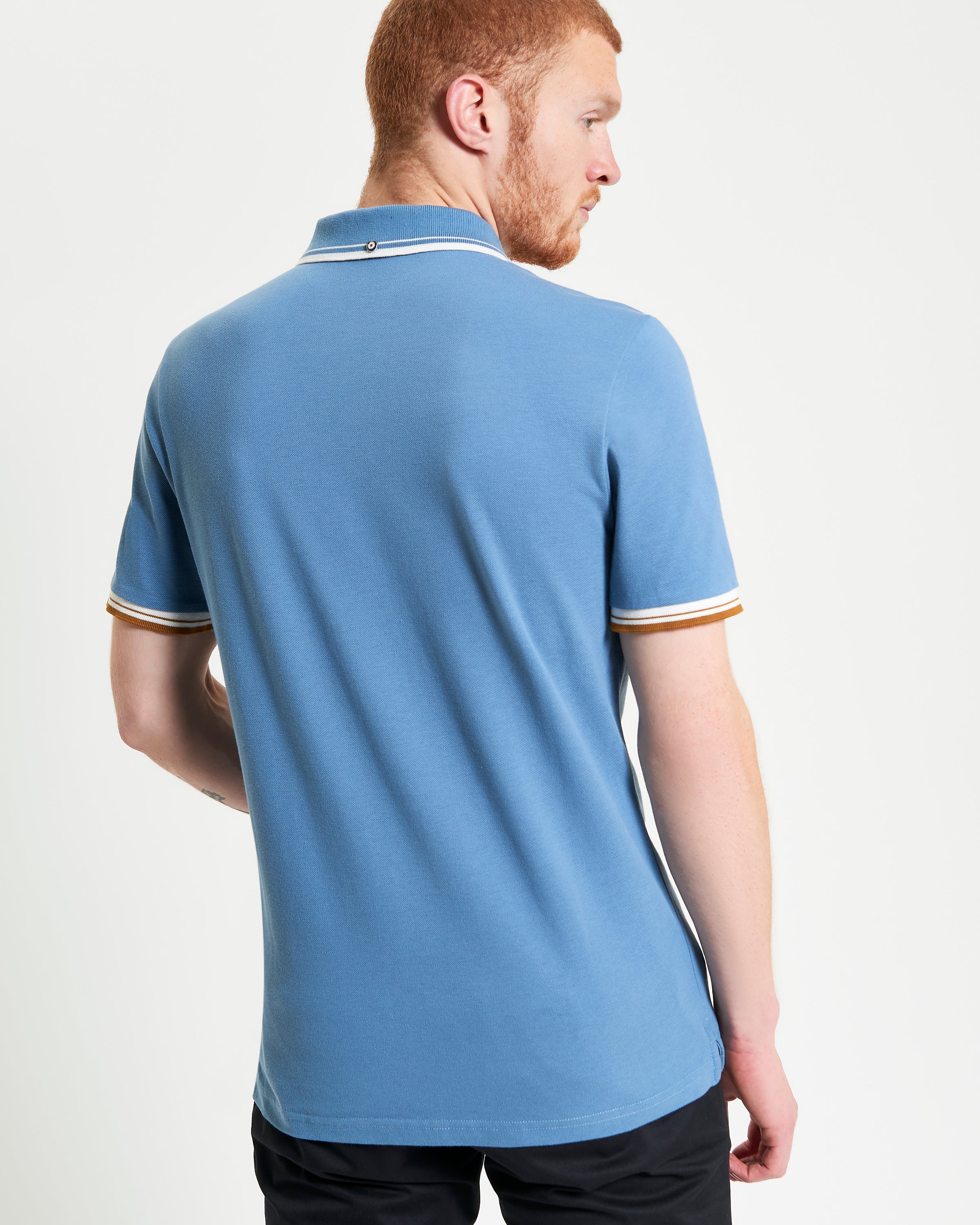 Signature Pique Polo – stylish blue polo shirt with contrast detailing, shown from the back.