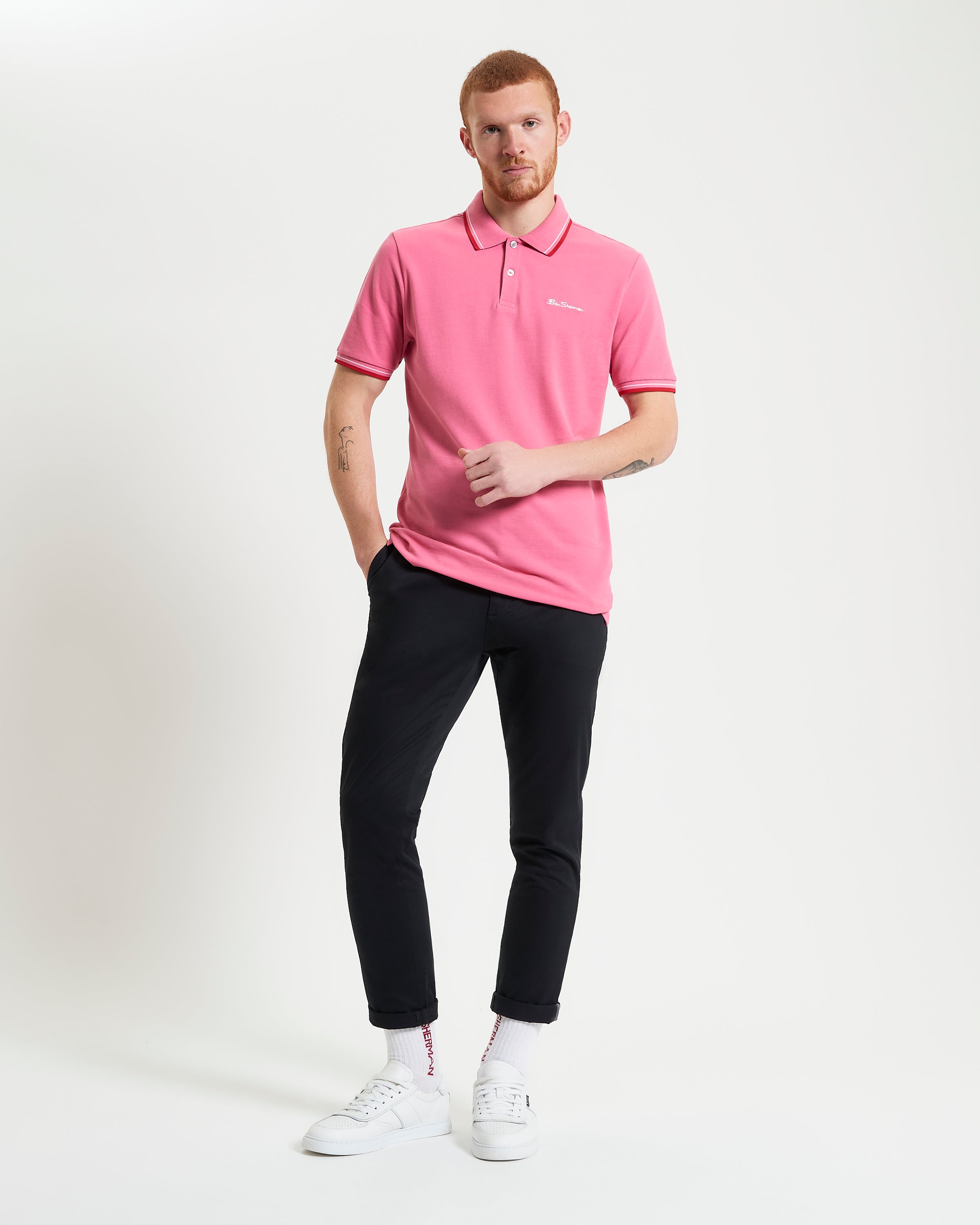 Signature Pique Polo – Pink – Regular Fit Polo Shirt styled with black pants and white sneakers.