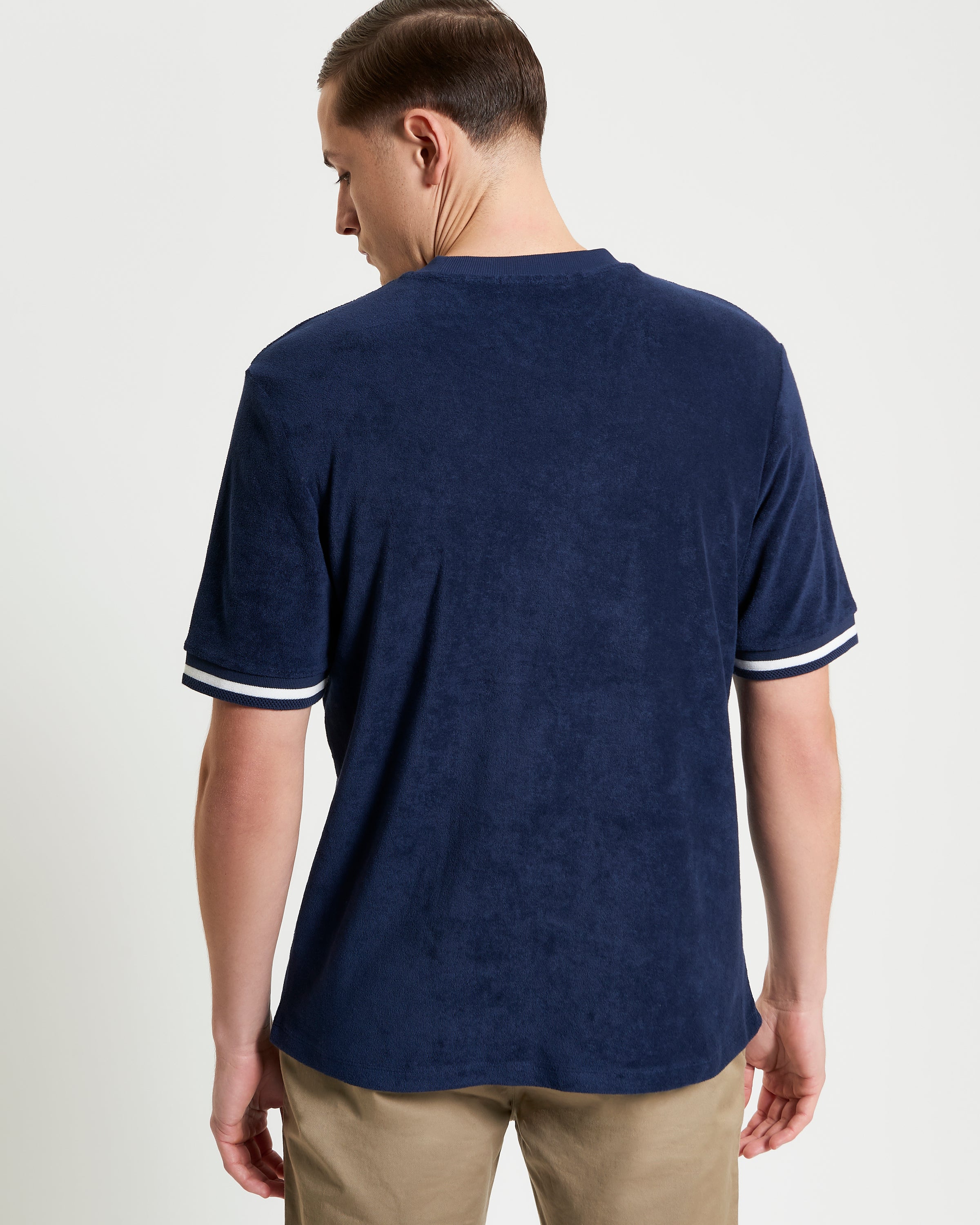 Towelling Tee – navy blue with stripe ribbed cuff at the back, showcasing a relaxed fit in luxurious towelling cotton.