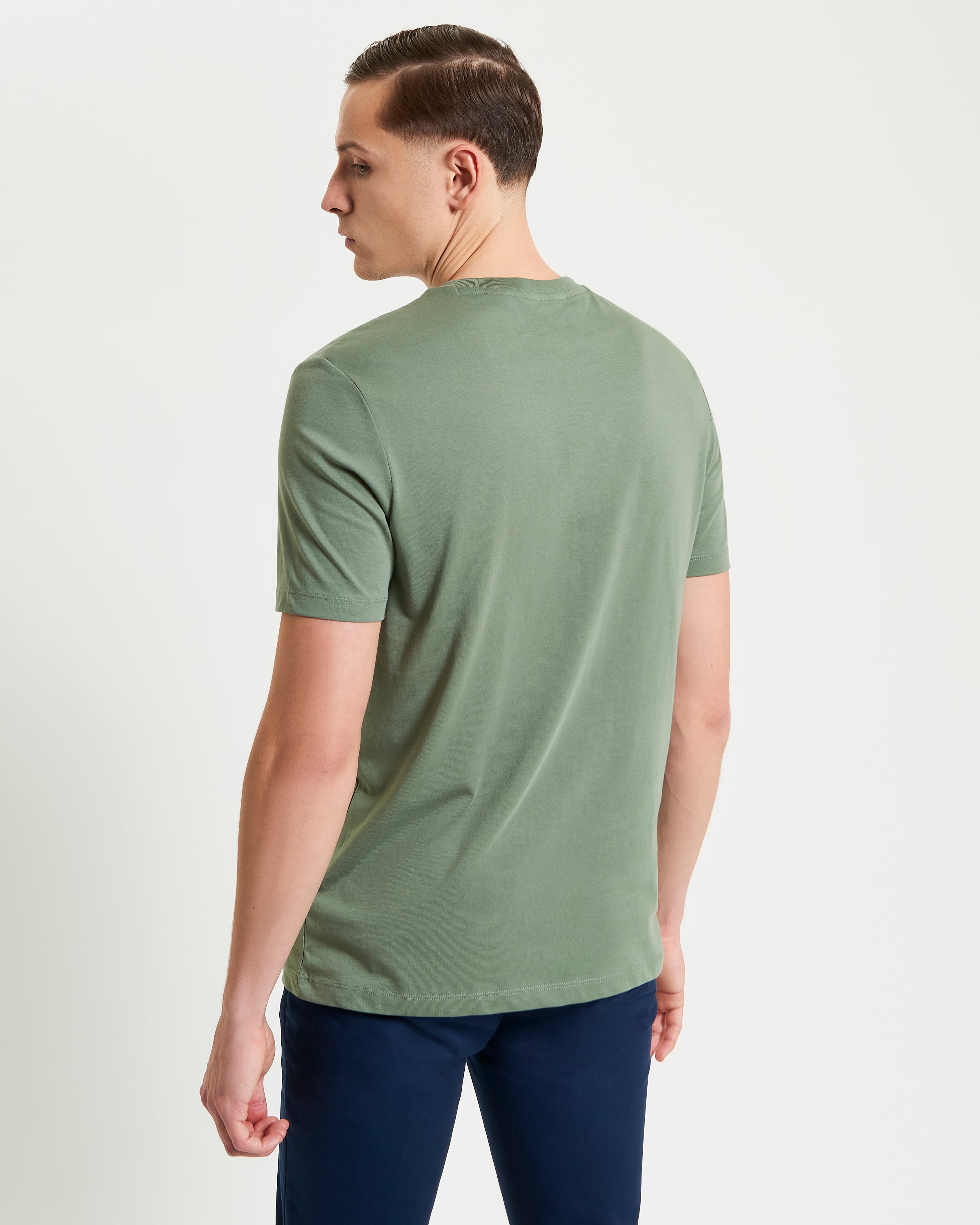 Signature Tee – olive green – back view of a man wearing a comfortable crew neck shirt.
