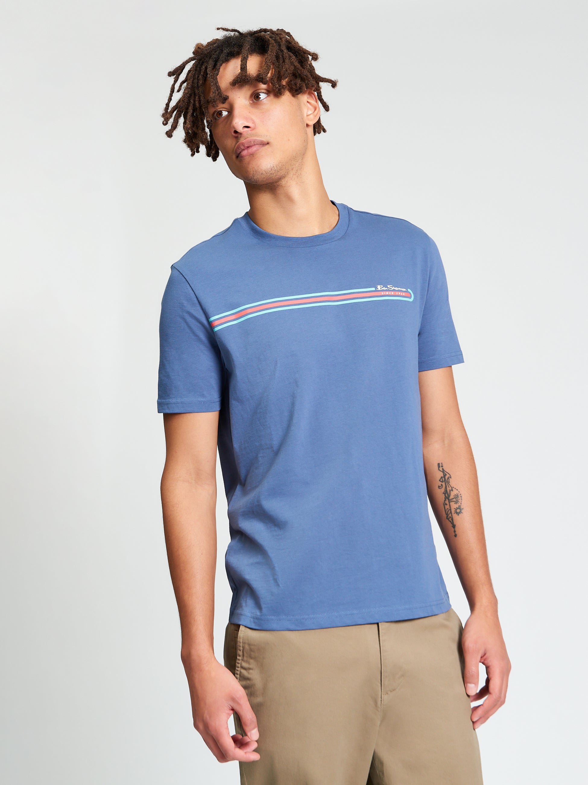 Core Stripe Tee – blue color with bold printed stripe design for everyday style.