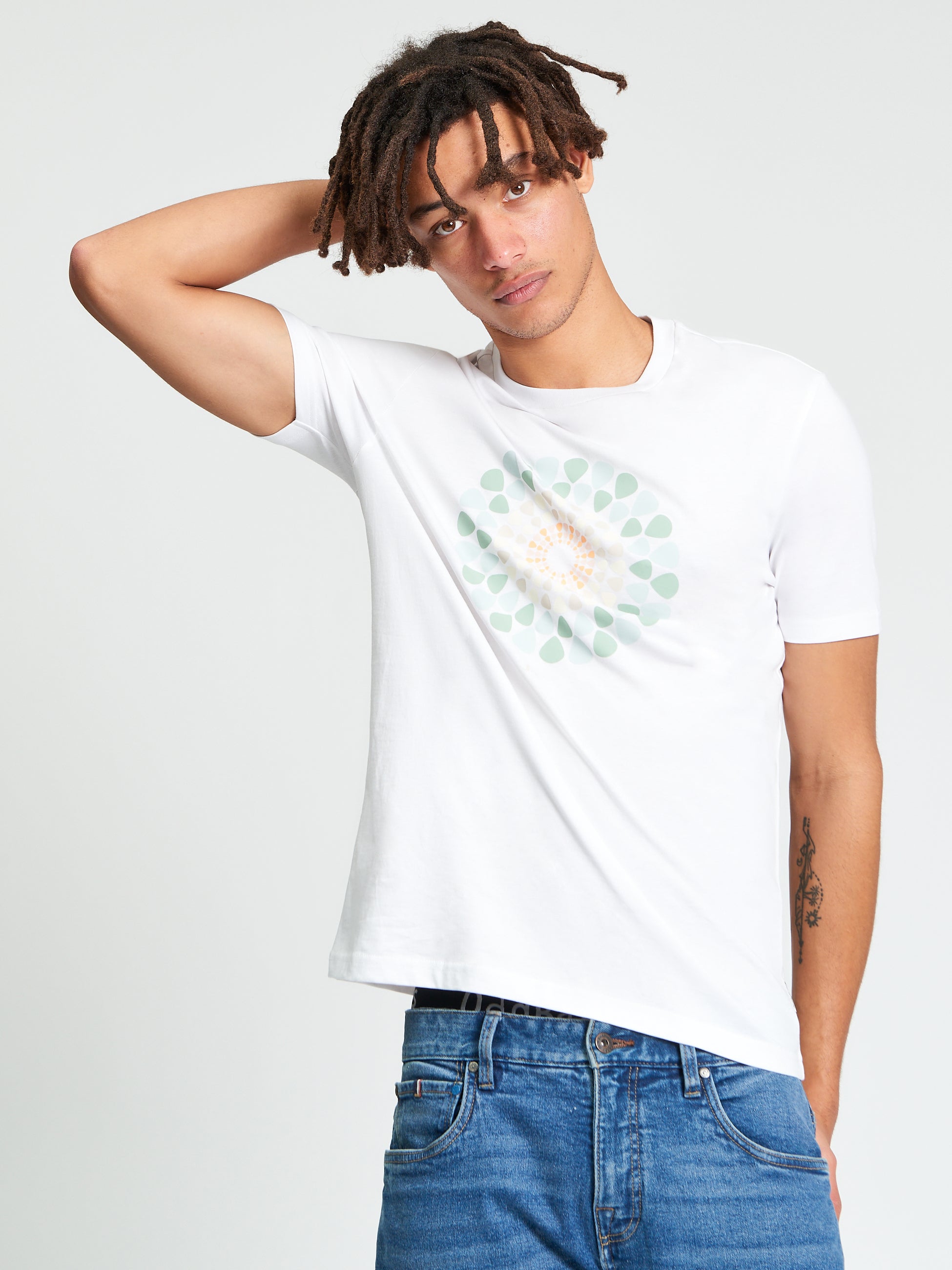 Plectrum Target Tee – White t-shirt featuring a target graphic design on a model.