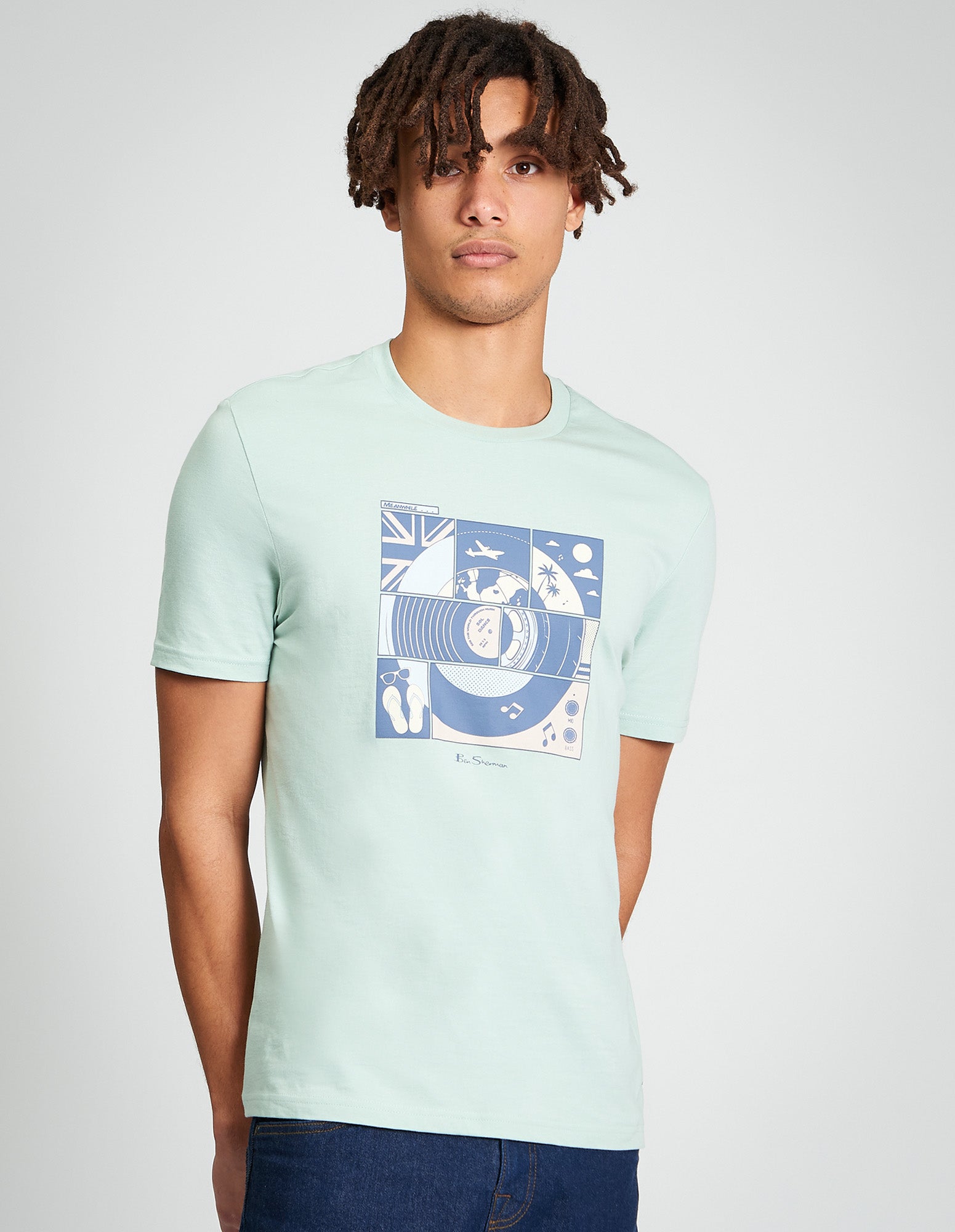 Comic Target Tee – summer graphic print on a green t-shirt, made from 100% organic cotton, worn by a male model.