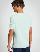 Comic Target Tee – back view of model wearing the tee in mint green color.