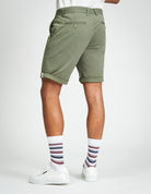Signature Chino Short – olive green, showcasing clean tailoring and signature detailing at the hem.
