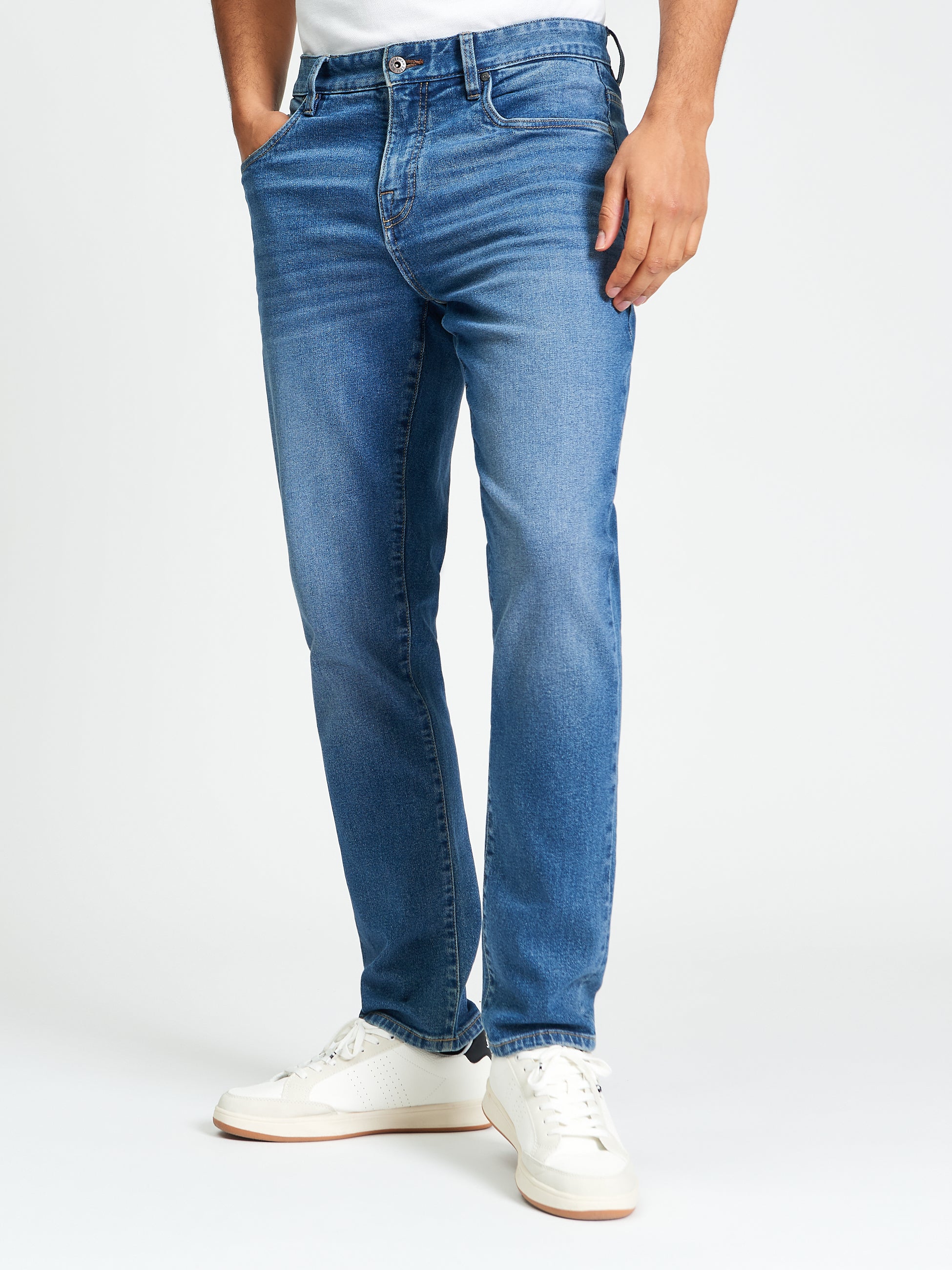 Slim Taper Denim – Blue jeans featuring a modern fit and stretch cotton for all-day comfort.