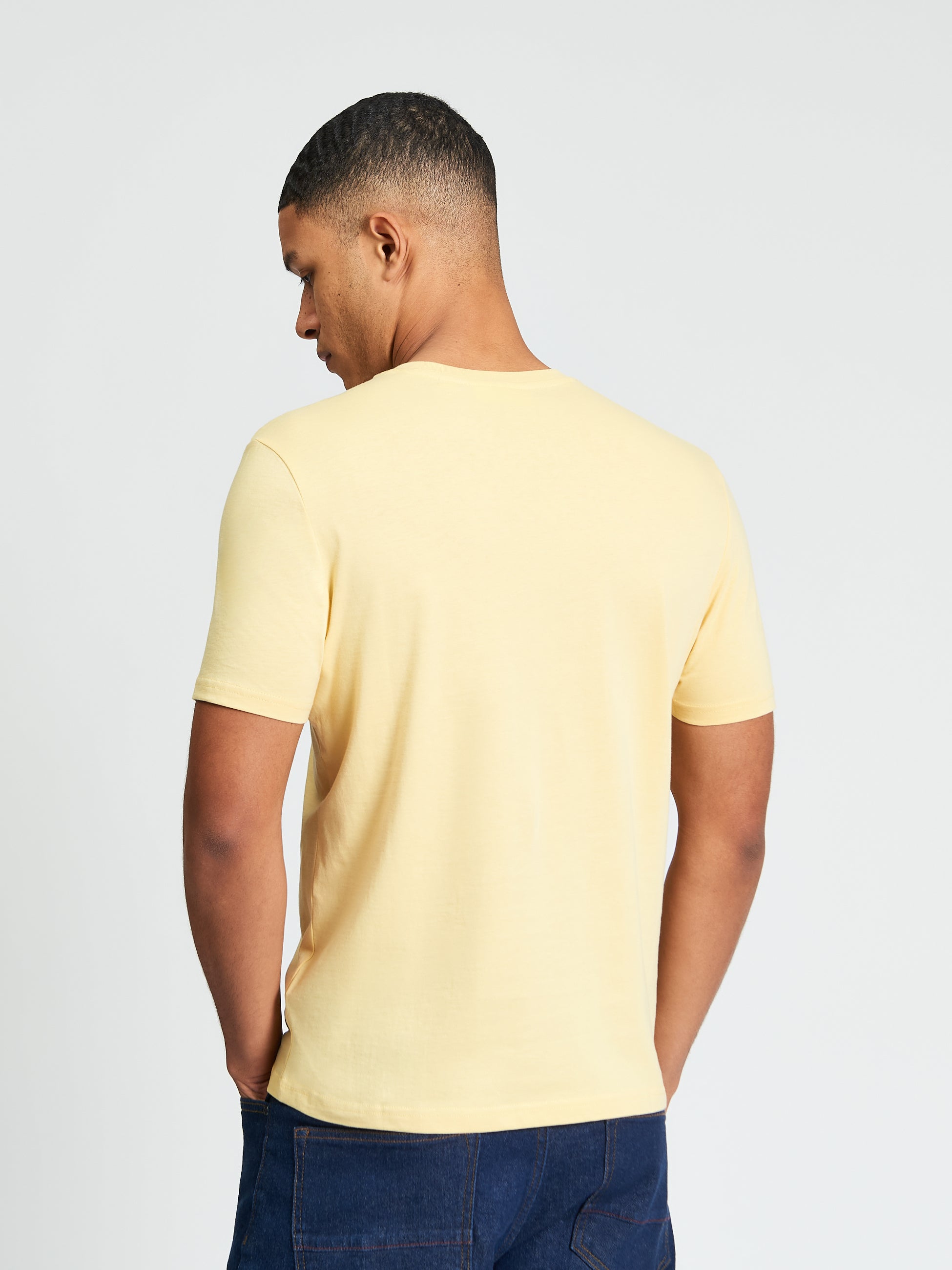 Signature Tee – Yellow – Back view of a man wearing a comfortable crew neck t-shirt.