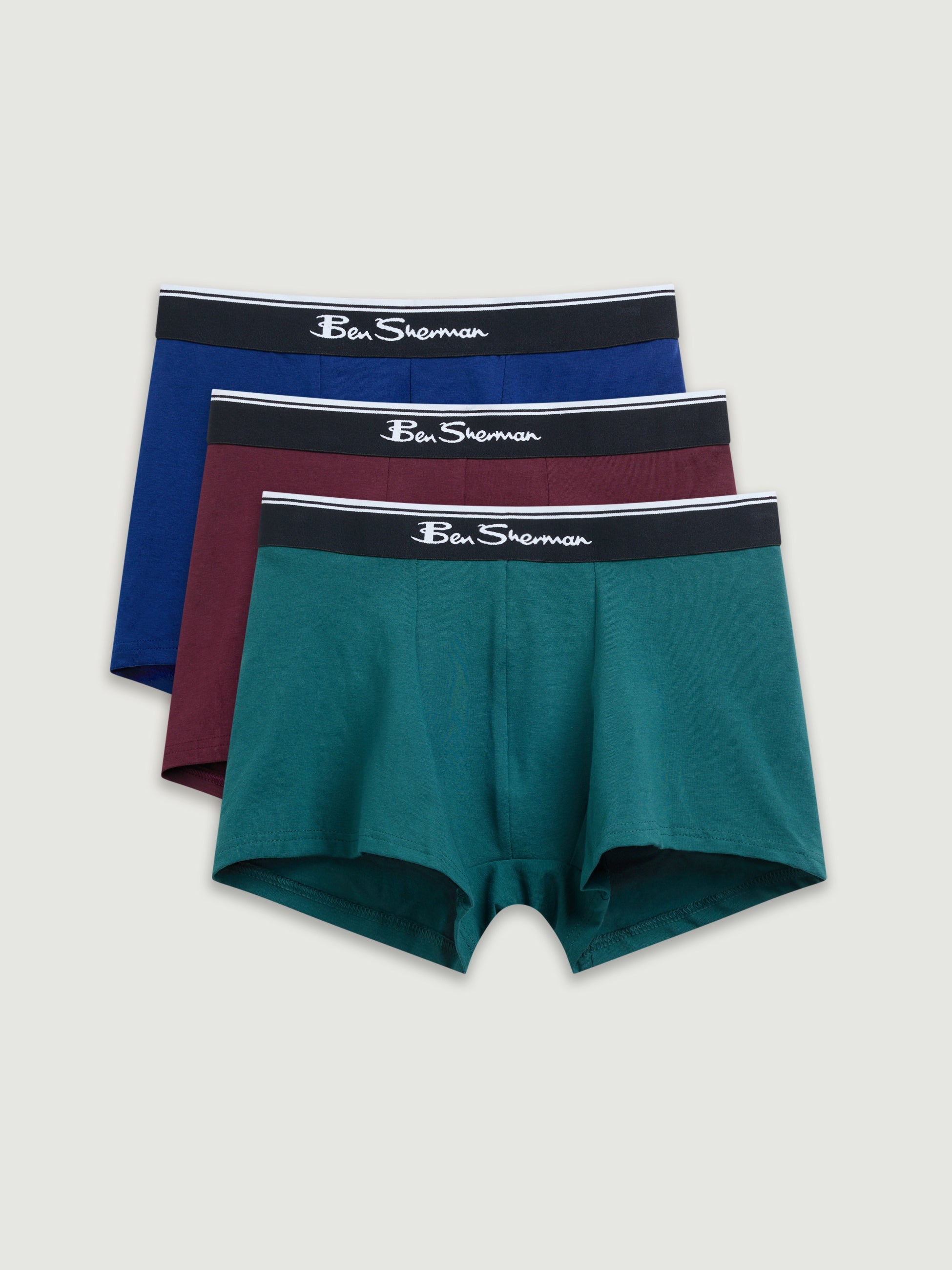 Three pairs of Ben Sherman boxer briefs in blue, red, and green on a light gray background.